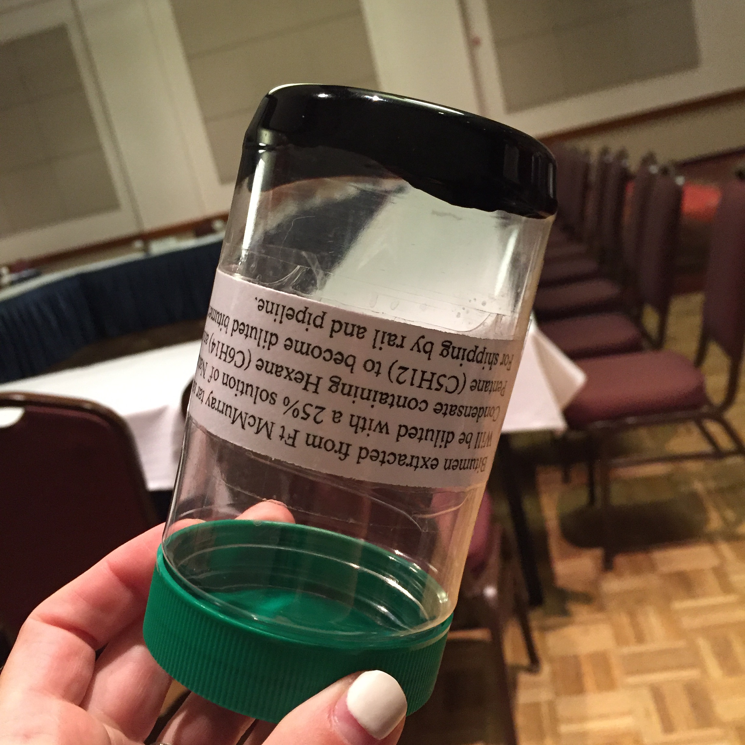 Bitumen specimen presented at Kinder Morgan ministerial meeting