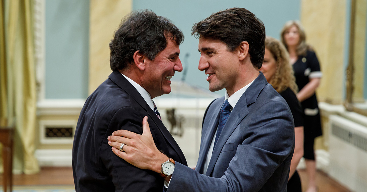 Minister Dominic LeBlanc shakes hands with the Prime Minister