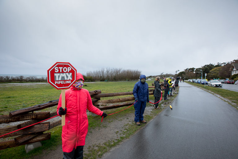 Stop TMX sign at Victoria red line event against Trans Mountain